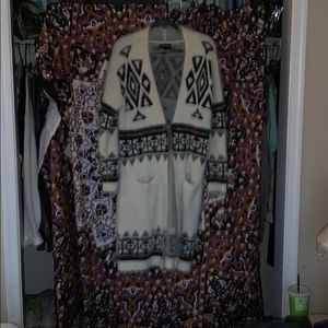 Long sleeved ankle length cardigan/sweater.